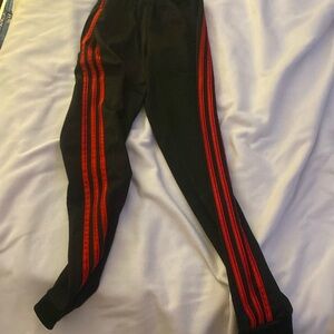 Black and red adidas sweatpants with stretchy waistband